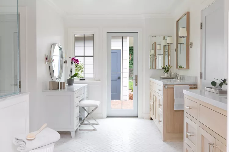 collected interiors makeup vanity f b a a af f b A spacious and well-lit bathroom.