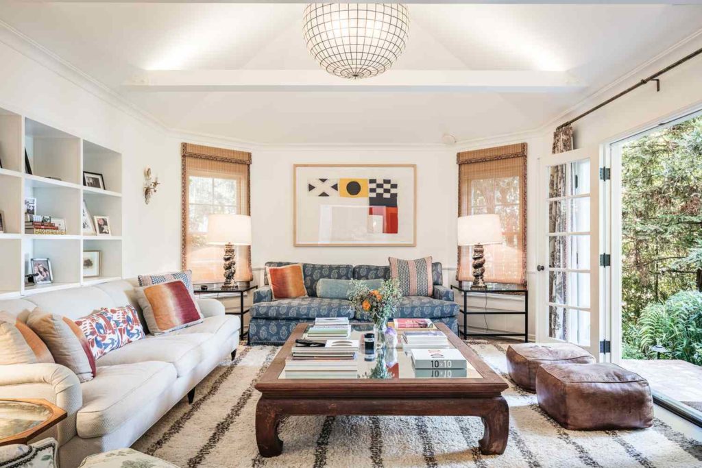 mixing antique accessories into modern decor hero dea d aa e c Bright living room with eclectic decor and garden view.