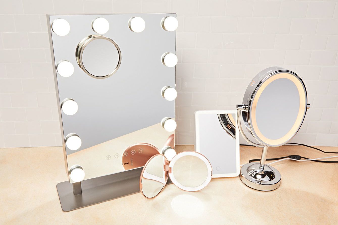 people tested mirrors lead e e aa eaa e c ad edited A makeup station displaying a rectangular and round mirror.