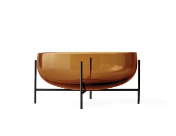 Wide amber Échasse Bowl with a rounded glass body raised on a dark slender four-legged stand