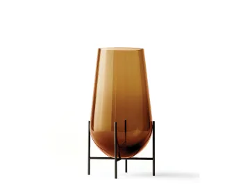 Medium amber Échasse Vase with a tapered glass body and rounded bottom raised on a dark slender stand