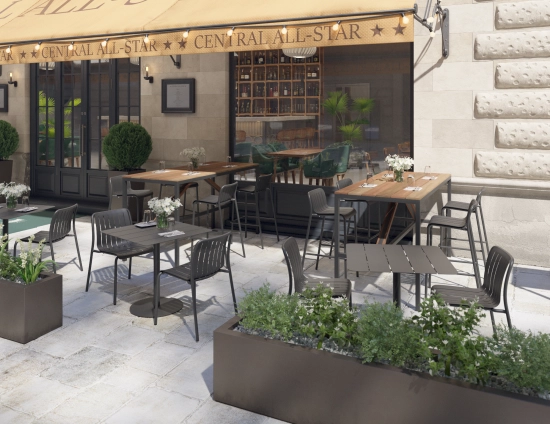 Cape High Bar Tables with brown slats and charcoal frames surrounded by stools outside a restaurant