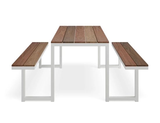 End view of the Integral Table and Bench Setting showing brown slats and two benches linked by a white frame
