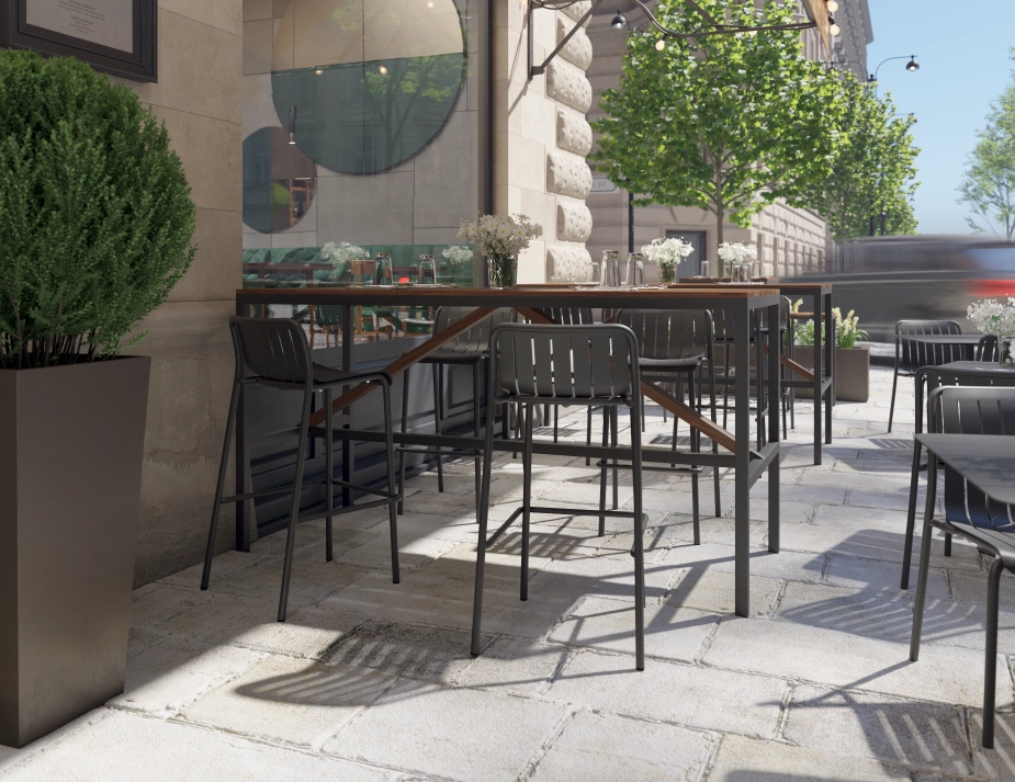 Cape High Bar Table with charcoal legs and brown diagonal braces, set with glasses on a restaurant terrace