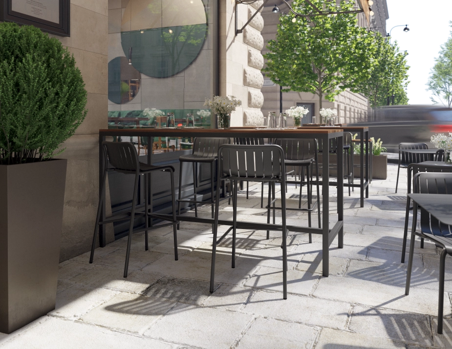 Kyenne High Bar Table with a brown top and charcoal frame, set with glasses on a restaurant terrace
