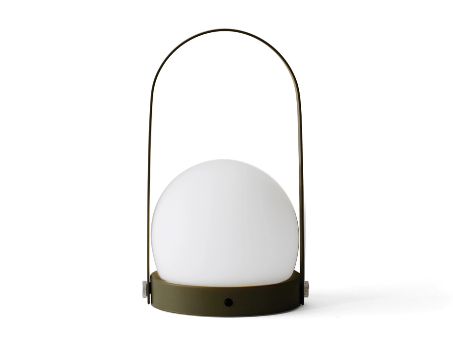 Olive green Carrie Table Lamp with a white globe shade, circular base and tall arched handle