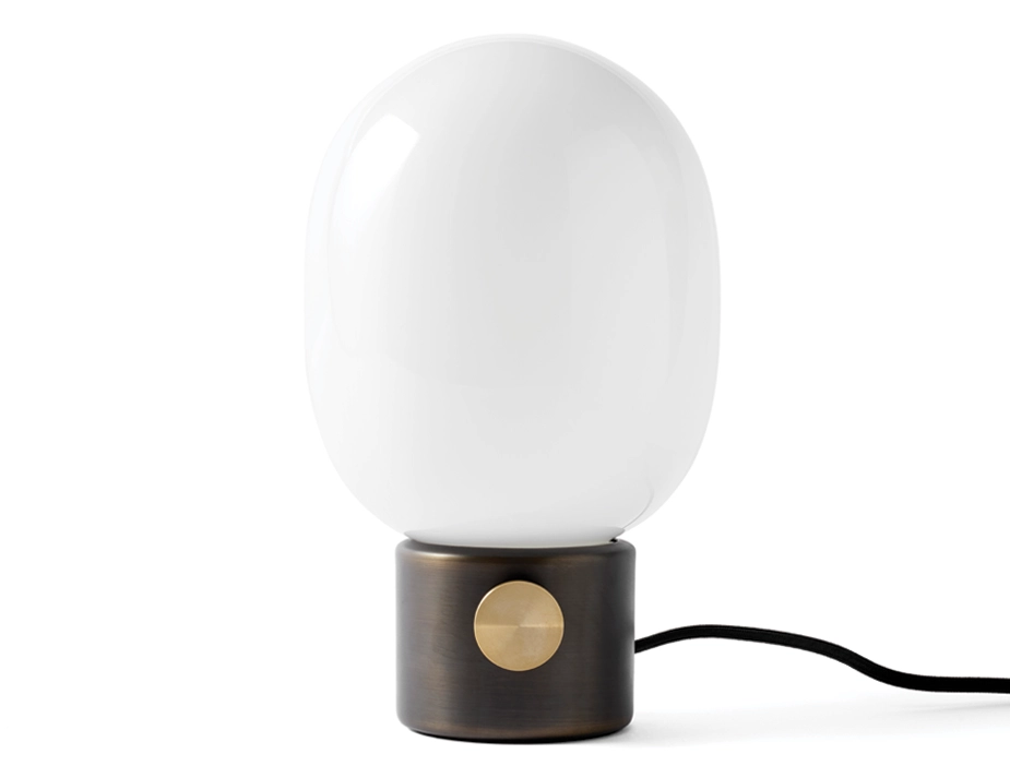 JWDA Table Lamp with a dark metallic cylindrical base, gold dimmer dial and rounded white shade